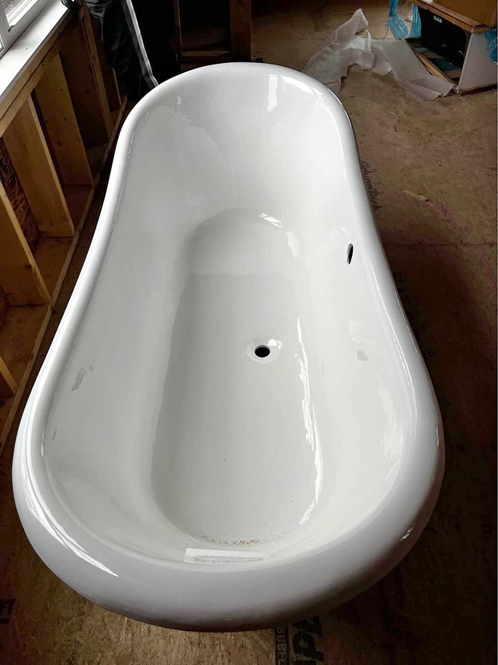 Dirty cast iron bathtub without any hardware