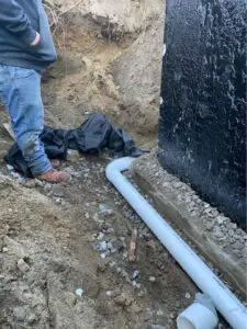 A basement perimeter drain installed on the bottom